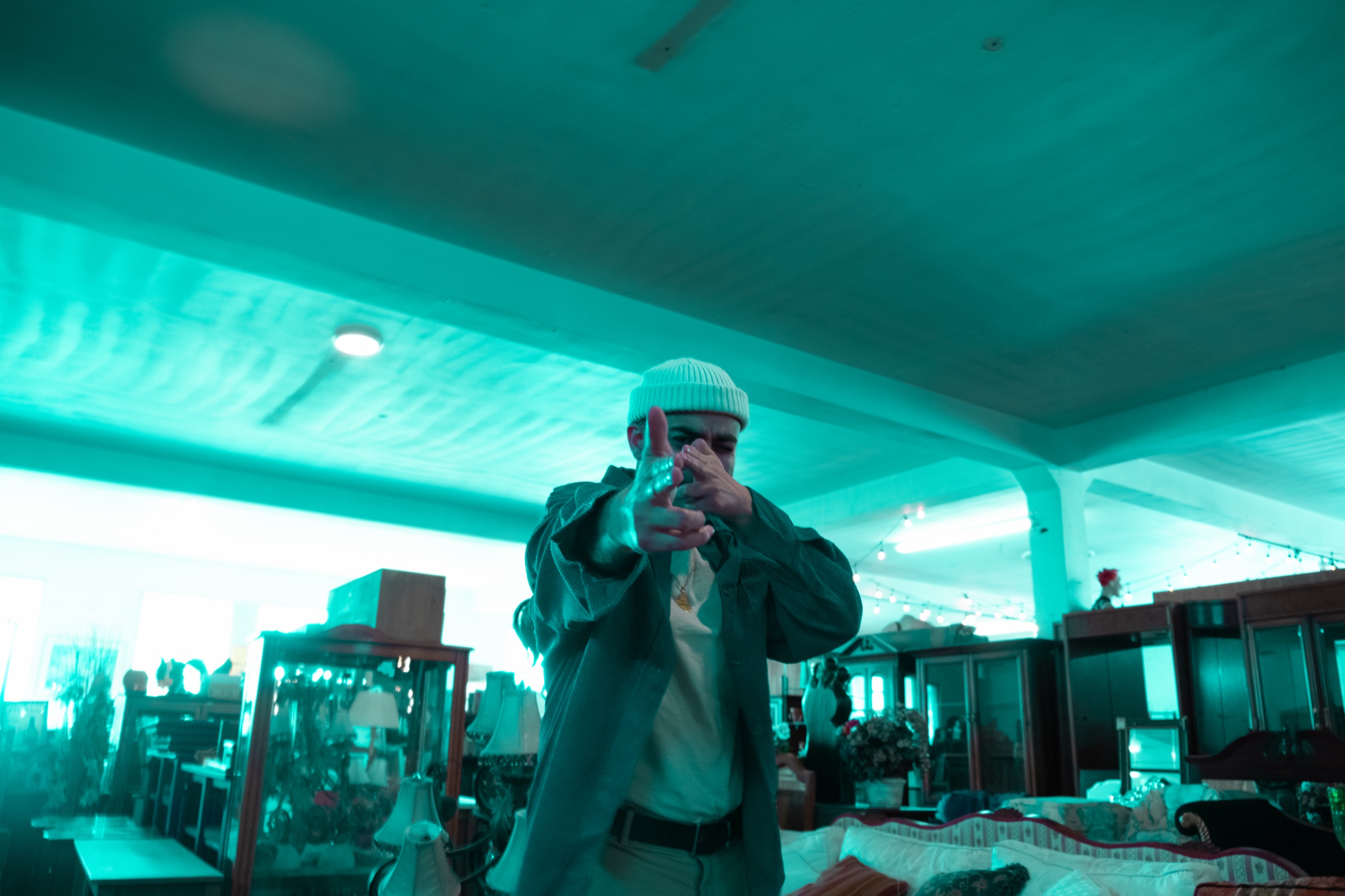 Younis Dhaher in a teal-lit room